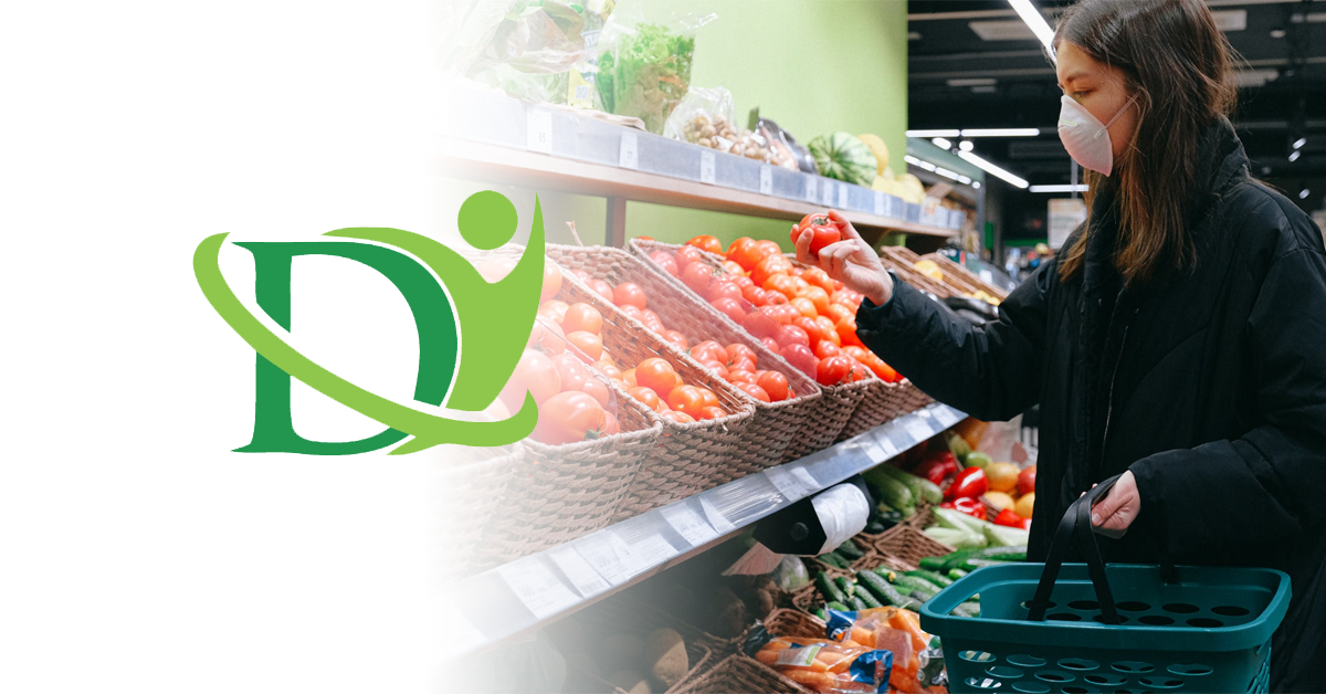 woman buying tomatos with mask